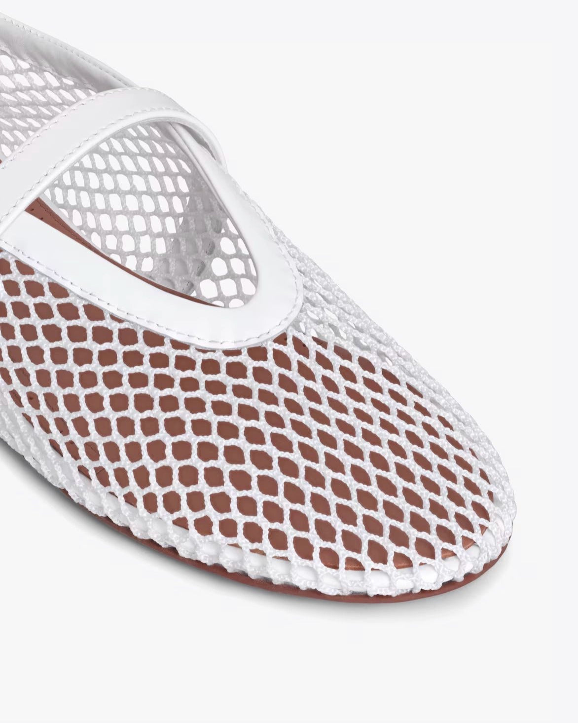 White mesh slip-on shoe on a white background