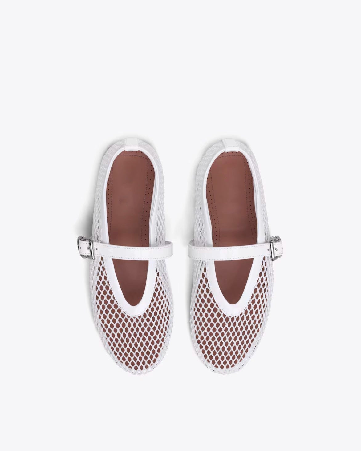 Pair of white mesh shoes with brown soles on a white background